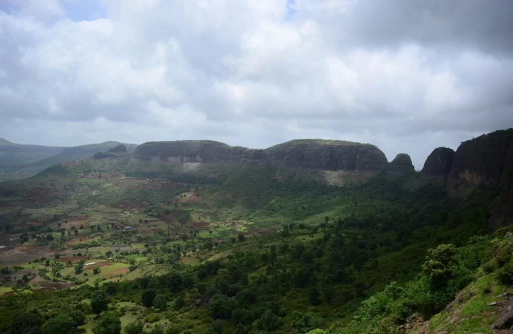 view from top of mountain rainy season monsoon Anjaneri hills shadow of clouds