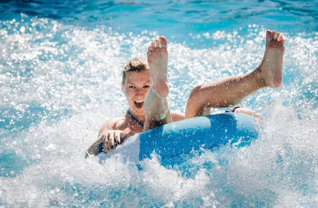 Funny girl taking a fast water ride