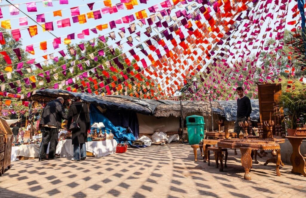 Wide angle view of vendors and stalls selling traditional items at the Dilli haat exhibition centre in New Delhi.