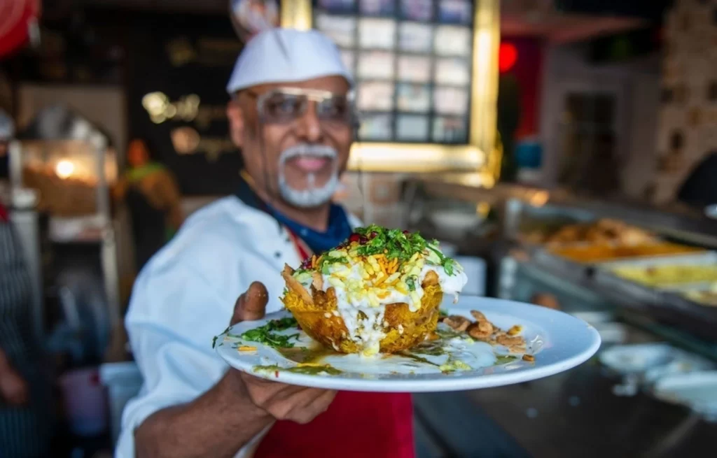 Hardayal Maurya chaat king owner of the shop making potato Basket Chaat. One of the most famous chaats in Lucknow is basket chaat