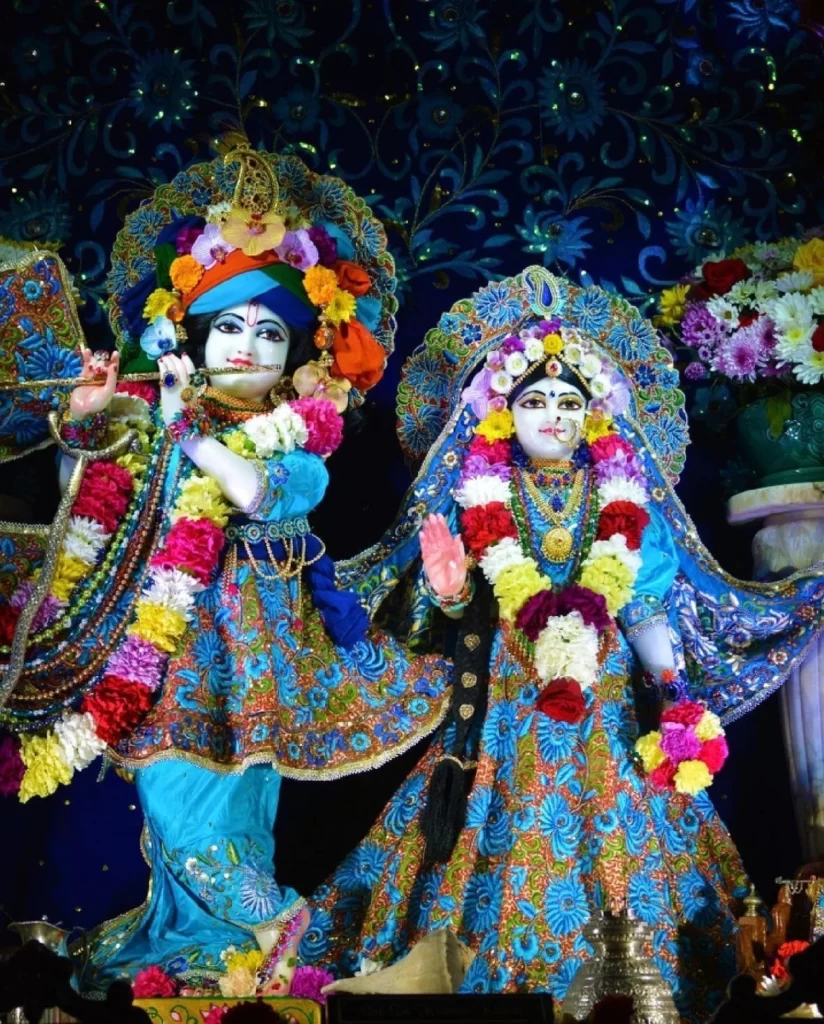 Radha and Krishna Deities picture of whole statue edits in beautiful blueish ornamental costumes and flower neckles